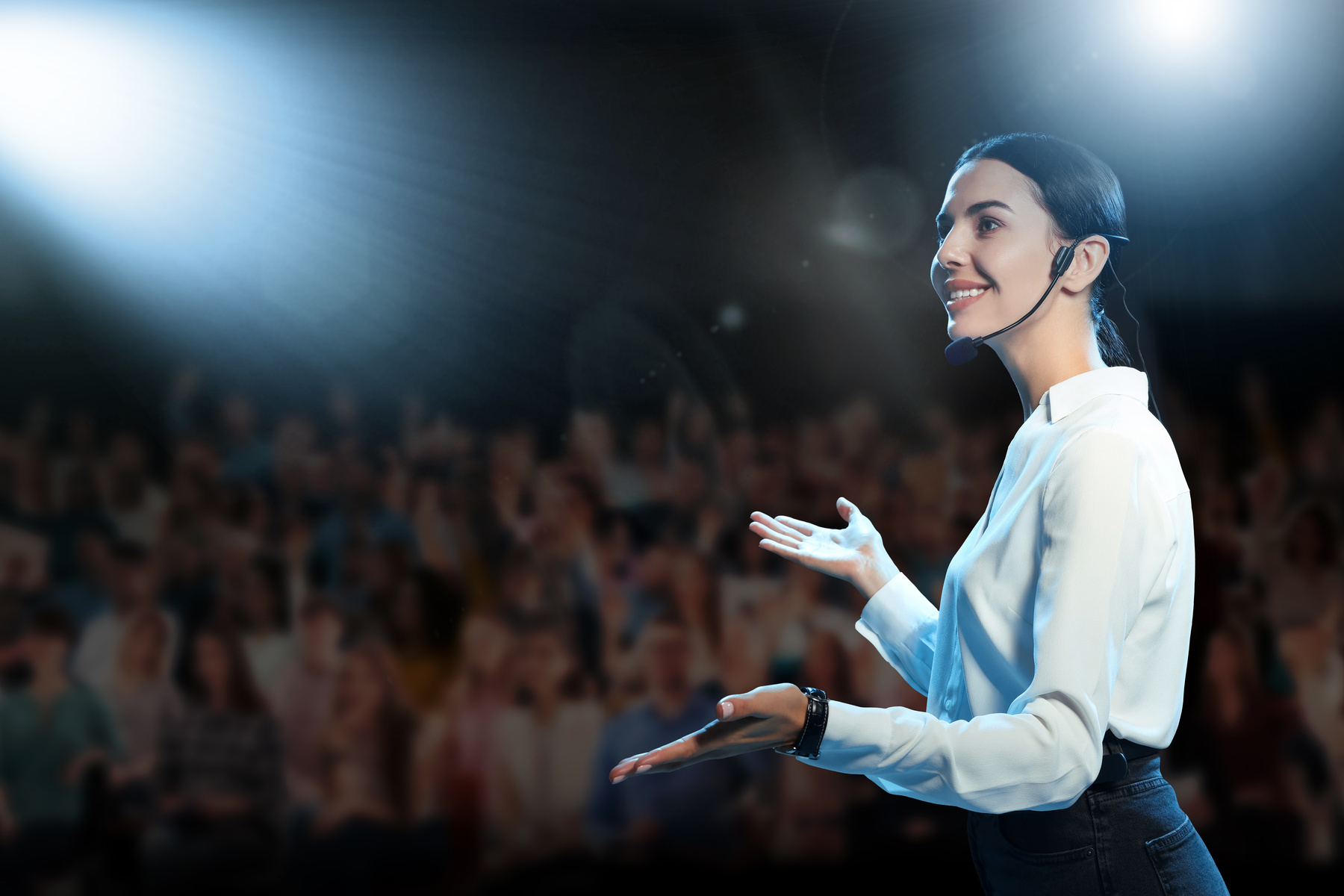 Motivational Speaker with Headset Performing on Stage